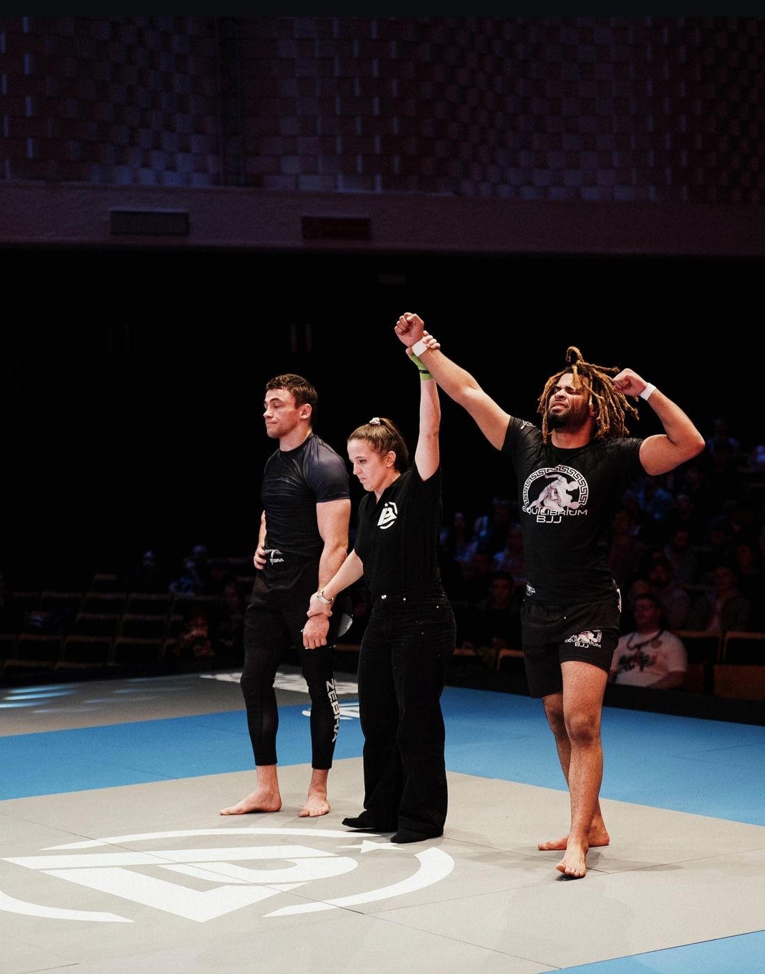 Equilibrium fighter with his hand raised after a win